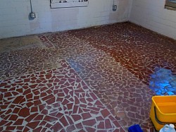Concrete flooring in the basement of a 3 bedroom home ( before )