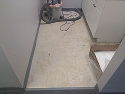 A small kitchen in an office setting  (before  )